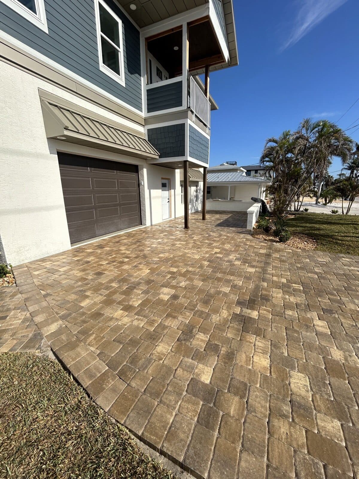 Multi-tone paver driveway at a coastal Cape Coral home